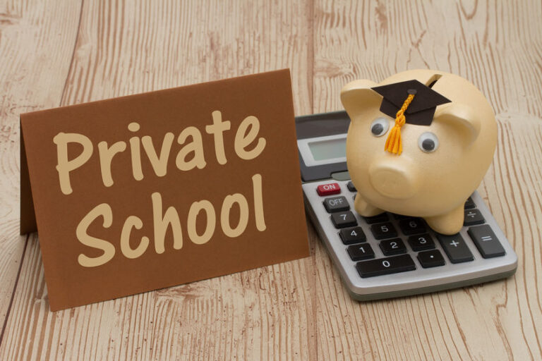 A private school sign beside a graduation-capped piggy bank and a calculator.